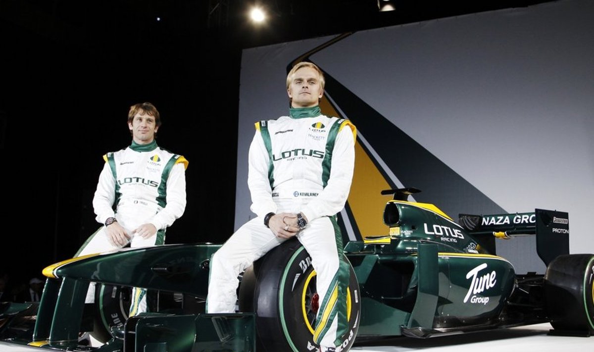 Formula 1 drivers Jarno Trulli (L) and Heikki Kovalainen sit on the Lotus T127 unveiled at a launch in London February 12, 2010.    REUTERS/Luke MacGregor  (BRITAIN - Tags: SPORT MOTOR RACING SOCIETY)