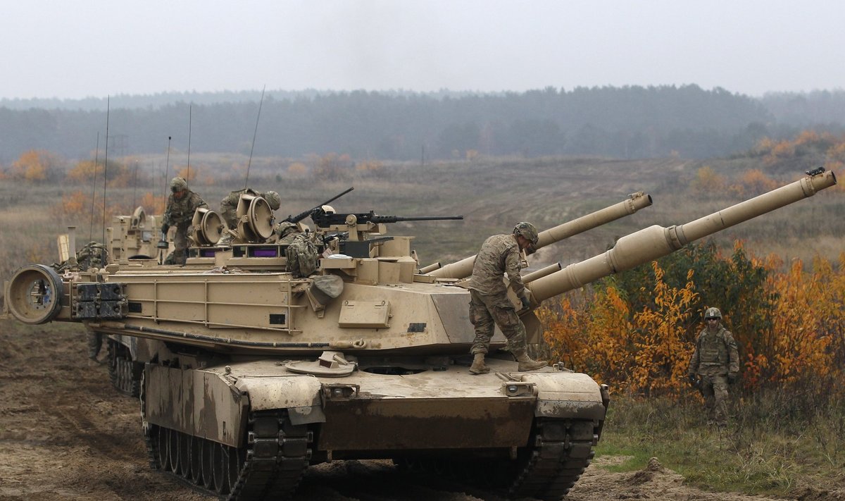 Members of the U.S. 1st Brigade Combat Team, 1st Cavalry Division disembark from an Abrams tank during a military exercise with Poland's 1st Mechanized Battalion of the 7th Coastal Defence Brigade near Drawsko-Pomorskie