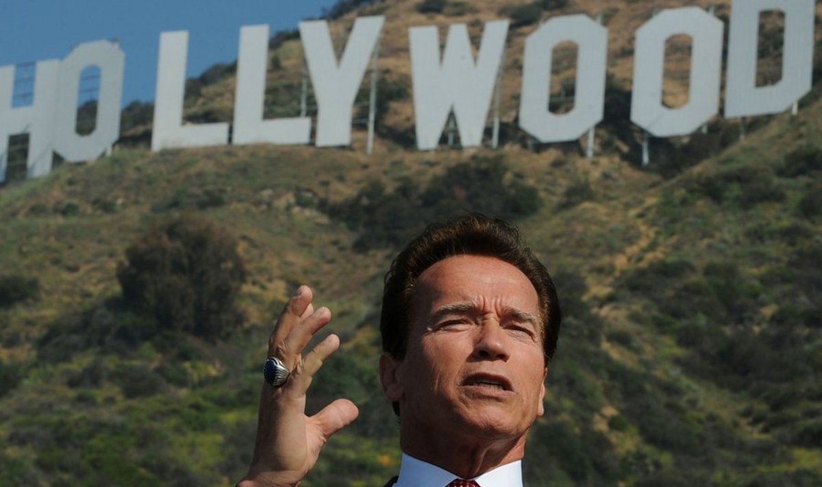 California Governor Arnold Schwarzenegger makes the announcement that sufficient money had been raised to purchase and protect the land around the historic Hollywood sign in Hollywood on April 26, 2010.  One of the City of Angels' most beloved attractions, views of the sign were in jeopardy and the group needed to find 12.5 million dollars to purchase the 138-acre (55-hectare) parcel of rugged land surrounding the sign from a Chicago-based consortium that had acquired rights to build four luxury mansions along the ridgeline. Playboy magazine founder Hugh Hefner made the final donation of $900,000 to reach the 12.5 million dollars required to complete the sale.                  AFP PHOTO/Mark RALSTON