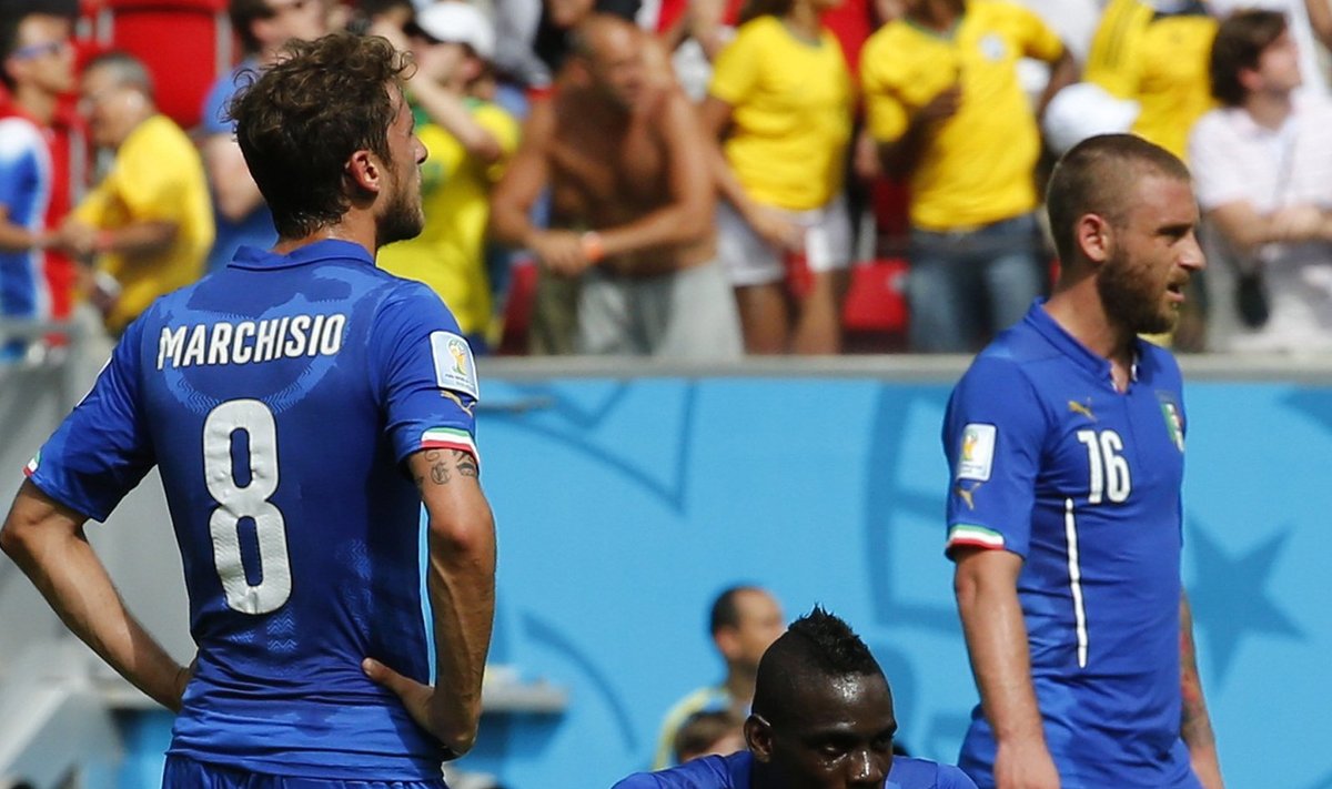 Italy's Claudio Marchisio, Balotelli and De Rossi react after a goal by Costa Rica's Bryan Ruiz during World Cup Group D soccer match at the Pernambuco arena