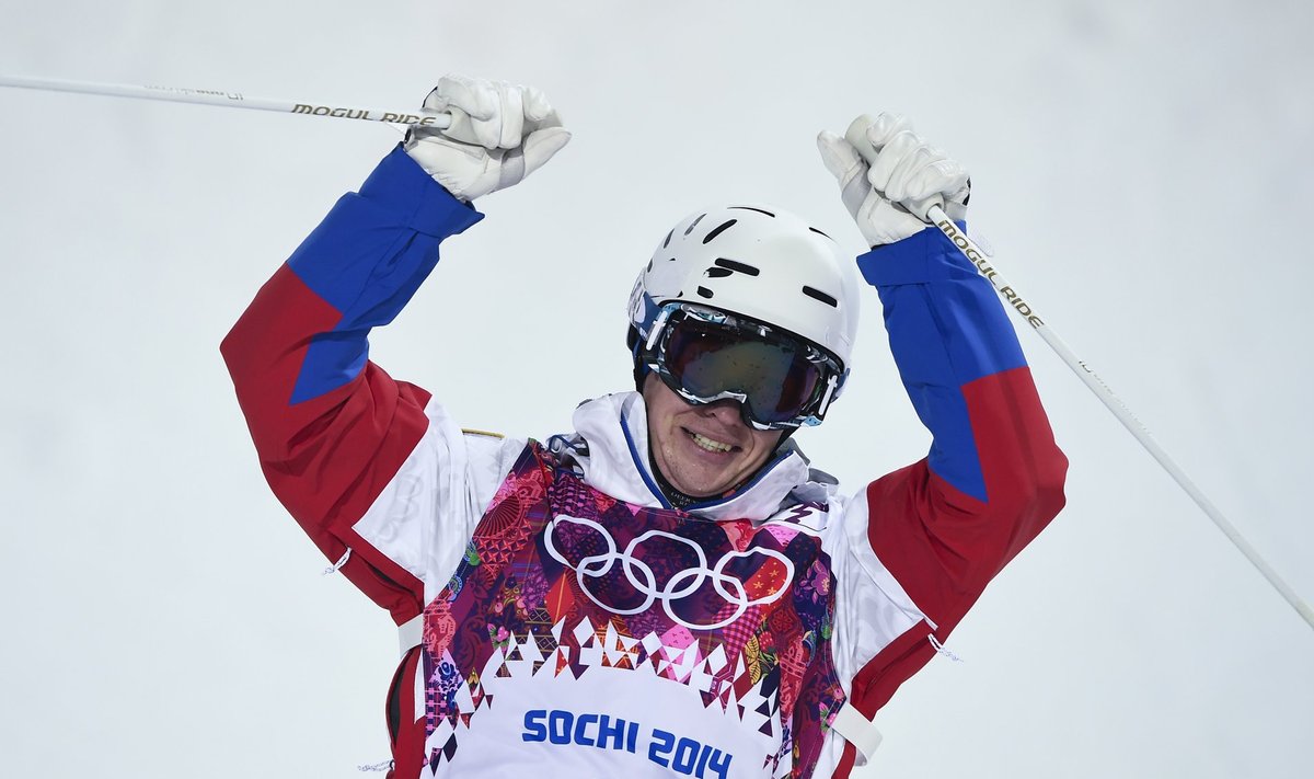 Russia's Smyshlyaev reacts in the finish line of the men's freestyle skiing moguls finals at the 2014 Sochi Winter Olympic Games in Rosa Khutor