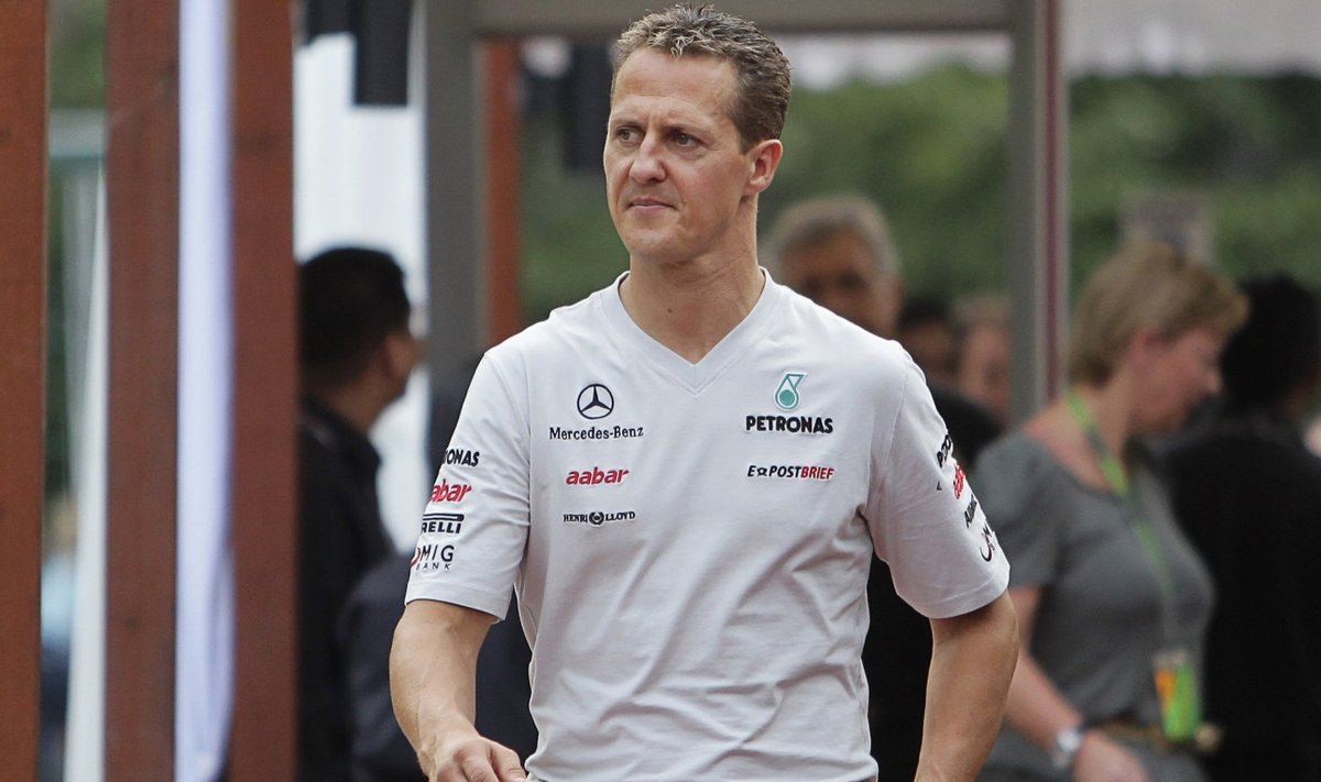 Mercedes Formula One driver Schumacher arrives for the third practice session of the Singapore F1 Grand Prix at the Marina Bay street circuit in Singapore
