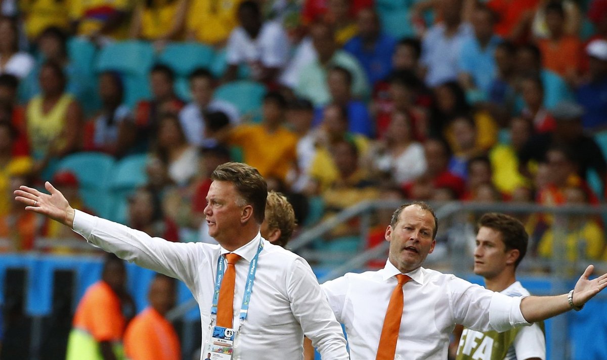 Netherlands coach Louis van Gaal and assistant coach Danny Blind react during their 2014 World Cup Group B soccer match against Spain at the Fonte Nova arena in Salvador
