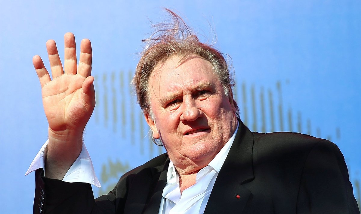 FILE PHOTO: Gerard Depardieu waves as he arrives during a red carpet event for the movie "Novecento- Atto Primo" at the 74th Venice Film Festival in Venice