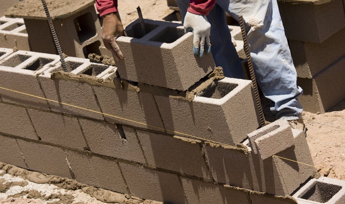 Migrant,Worker,Building,Cinder,Block,Wall,In,Desert,Setting.