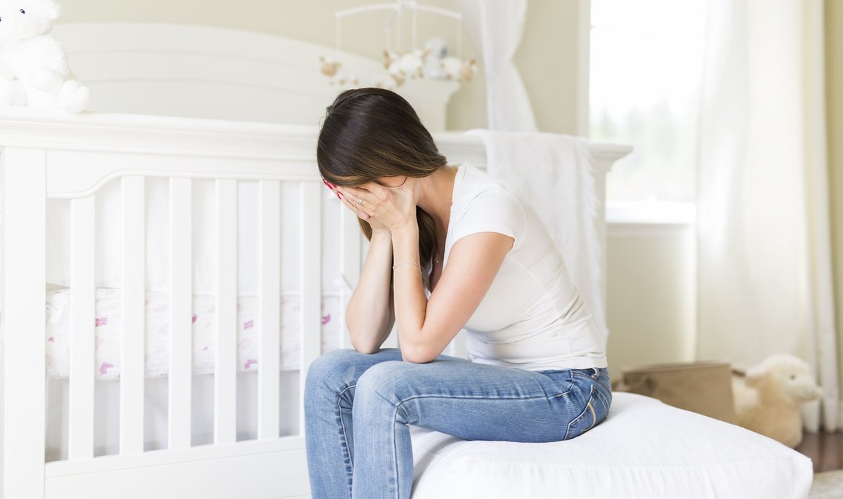 A,Depressed,Young,Woman,In,Baby,Room