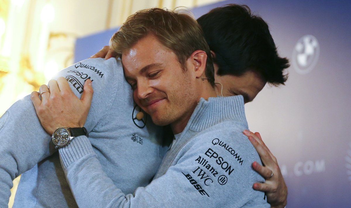 Mercedes' Formula One World Champion Nico Rosberg of Germany hugs Mercedes Executive Director Toto Wolff in Vienna