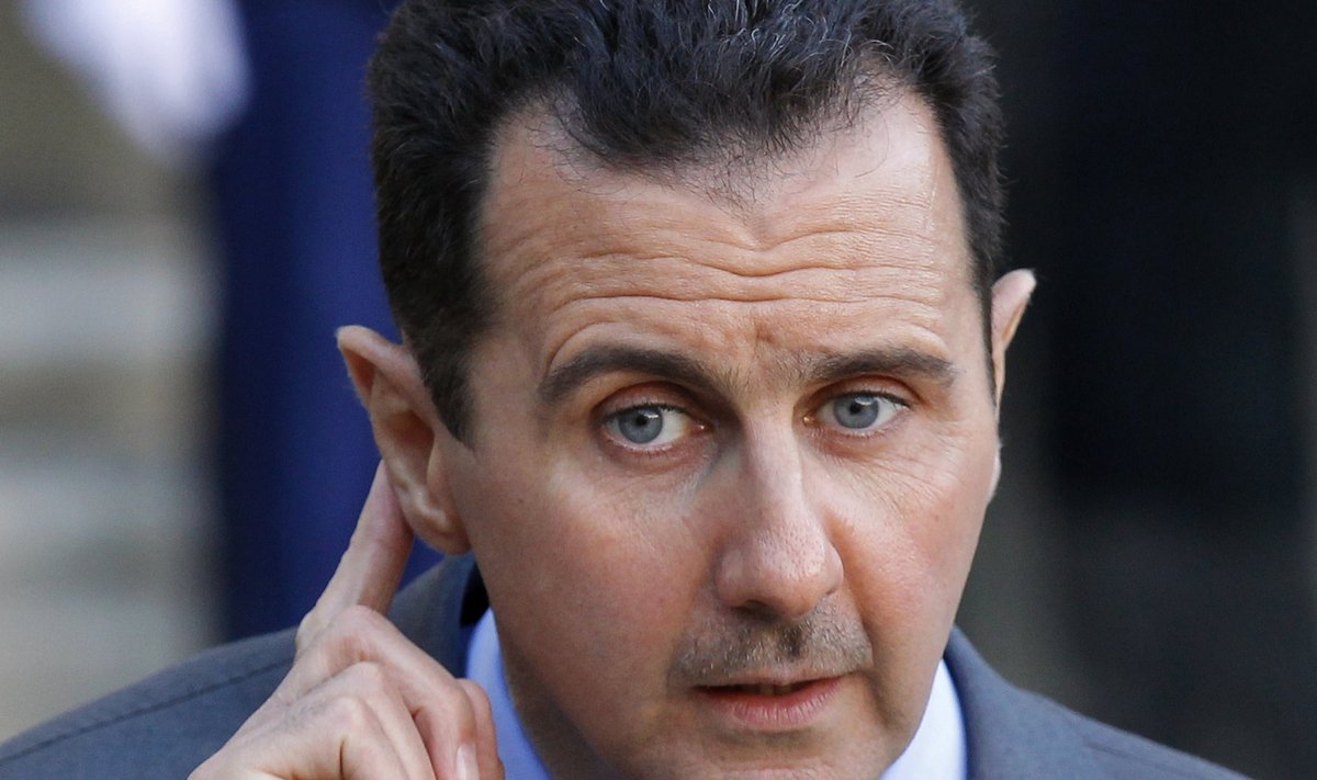 File photo of Syria's President Bashar al-Assad answering journalists after a meeting at the Elysee Palace in Paris