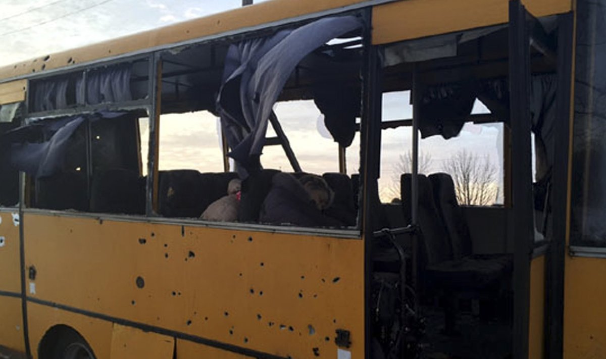 A passenger bus damaged by recent shelling at a checkpoint of the Ukrainian forces in the village of Bugas, south of Donetsk