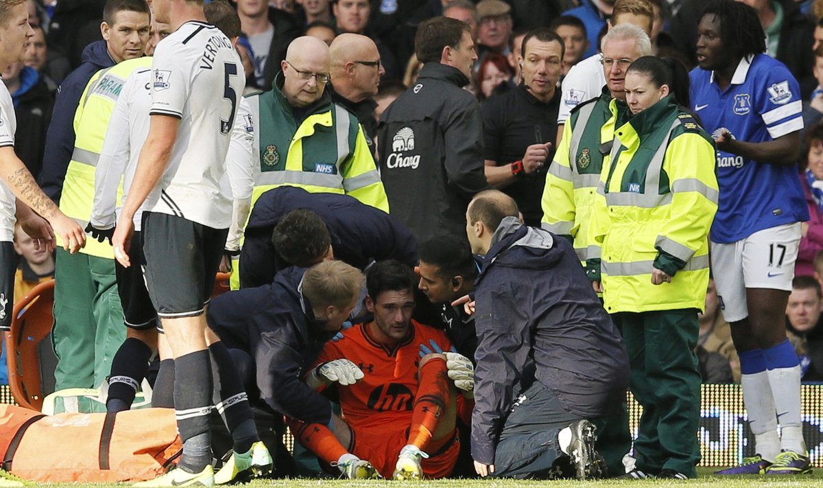 Tottenham Hotspur's goalkeeper Lloris is attended to by medical staff after being involved in a collision with Everton's Lukaku during their English Premier League soccer match at Goodison Park in Liverpool
