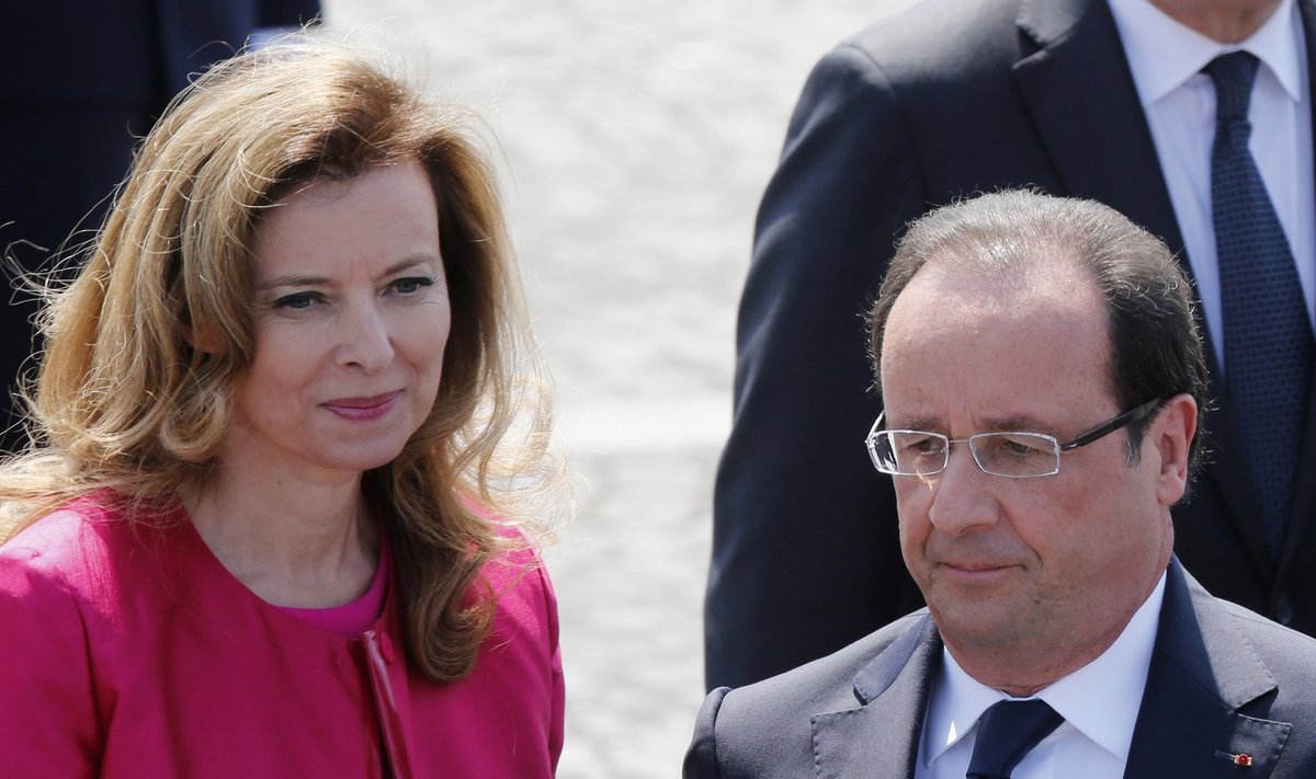 File photo of French President Hollande and his companion Trierweiler at Bastille day military parade in Paris