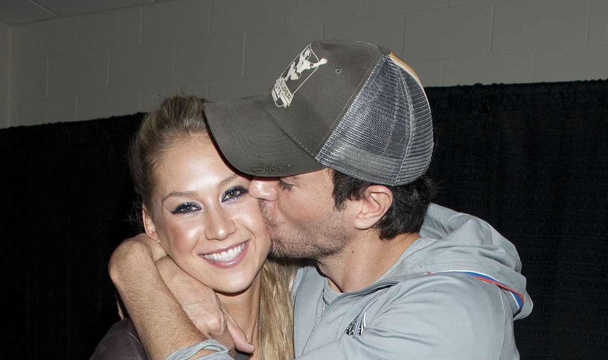 Enrique Iglesias and his girlfriend, tennis star, Anna Kournikova hang out backstage in the Just Jared lounge at the Y100 Jingle Ball on December 11, 2010 in Miami, Florida.