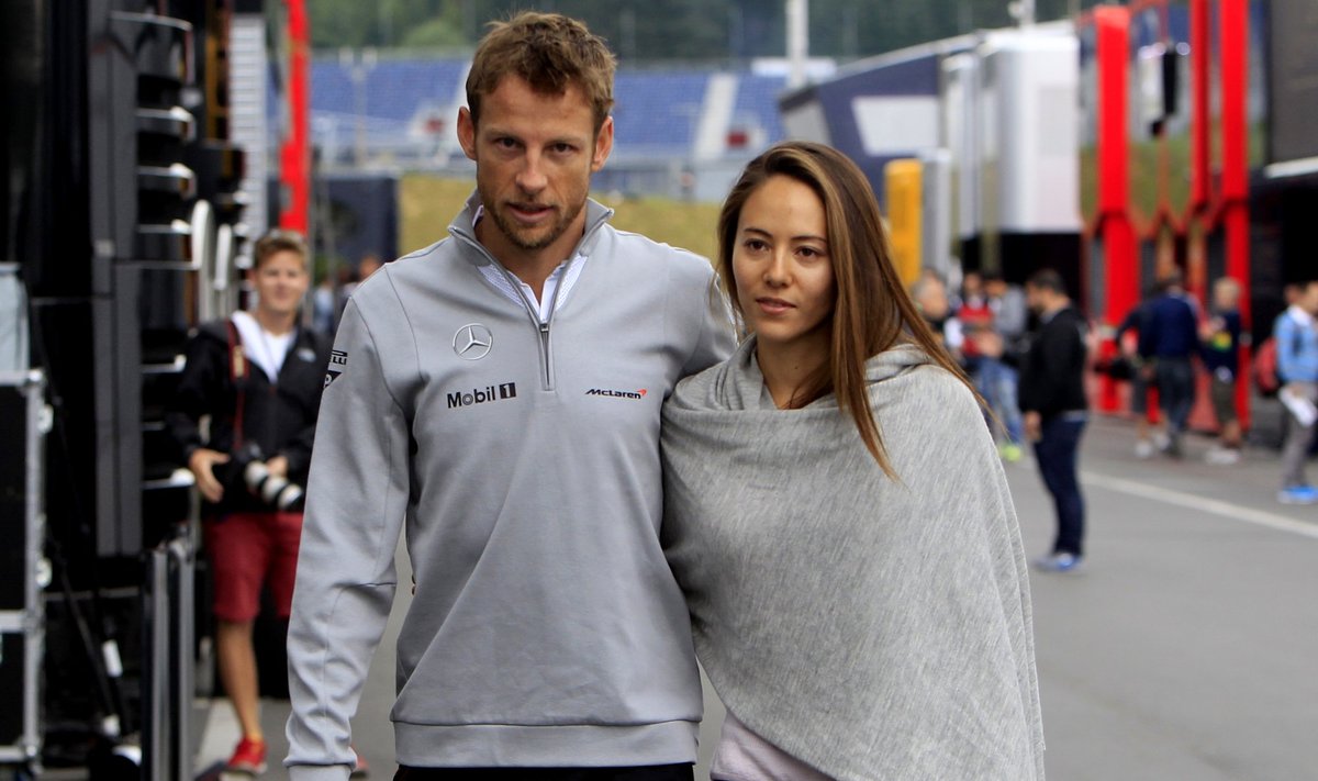 McLaren Formula One driver Button of Britain arrives with his fiancee Michibata to the Red Bull Ring circuit in Spielberg