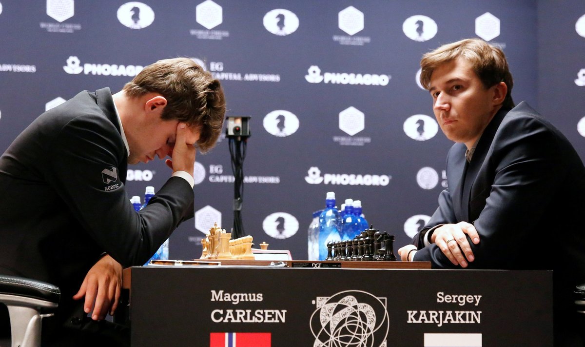Magnus Carlsen, of Norway, reacts at his match with Sergey Karjakin, of Russia, during their round 5 of the 2016 World Chess Championship in New York