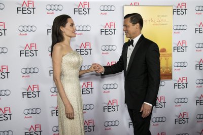 Director and cast member Jolie and her husband and co-star Pitt hold hands at the premiere of "By the Sea" during the opening night of AFI FEST 2015 in Hollywood