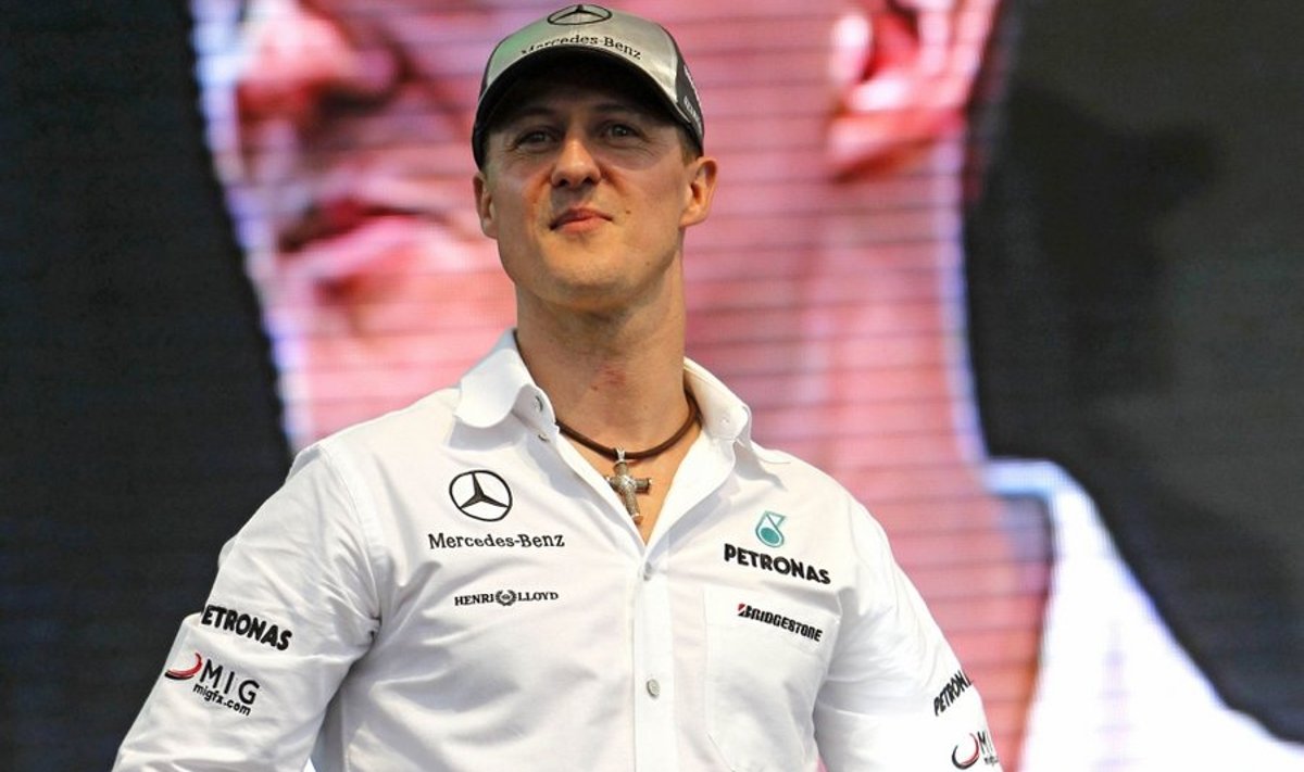 German Formula One driver Michael Schumacher of Mercedes GP smiles during a meet the fans event in Kuala Lumpur, Malaysia Tuesday, March 30, 2010. The Malaysian Grand Prix will take place on April 4, 2010. (AP Photo/Vincent Thian) / SCANPIX Code: 436