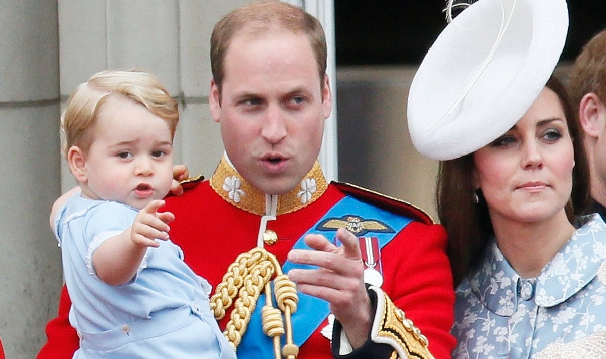 Britain's Prince Willian holds Prince George as he waves with Catherine, the Duchess of Cambridge on the balcony at Buckingham Palace after attending the Trooping the Colour ceremony at Horse Guards Parade in central London