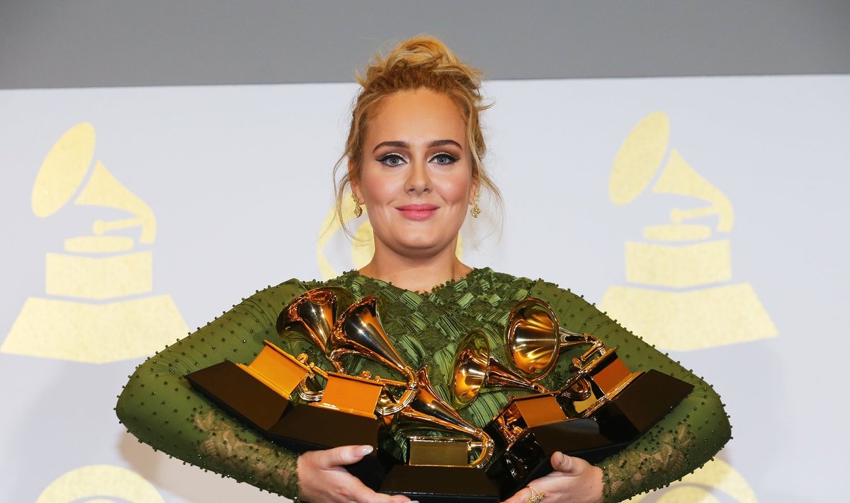 Adele holds her five Grammys during the 59th Annual Grammy Awards in Los Angeles