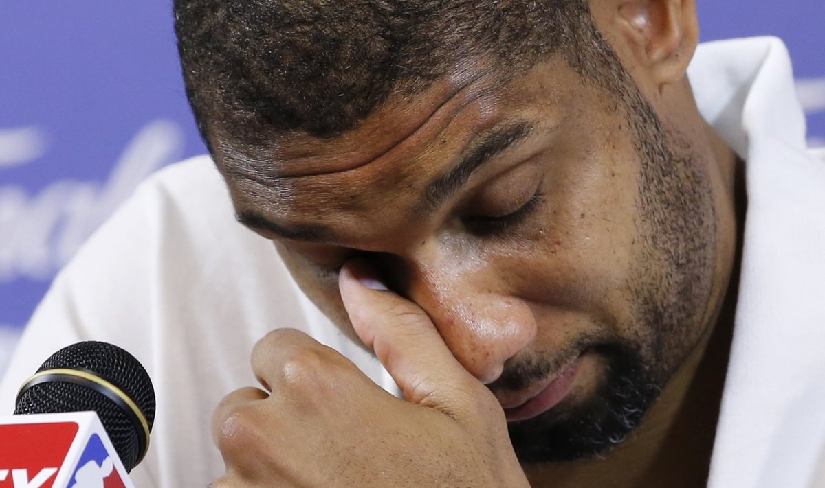 Spurs' Duncan reacts during a press conference after his team lost Game 7 to the Heat of their NBA Finals basketball playoff in Miami