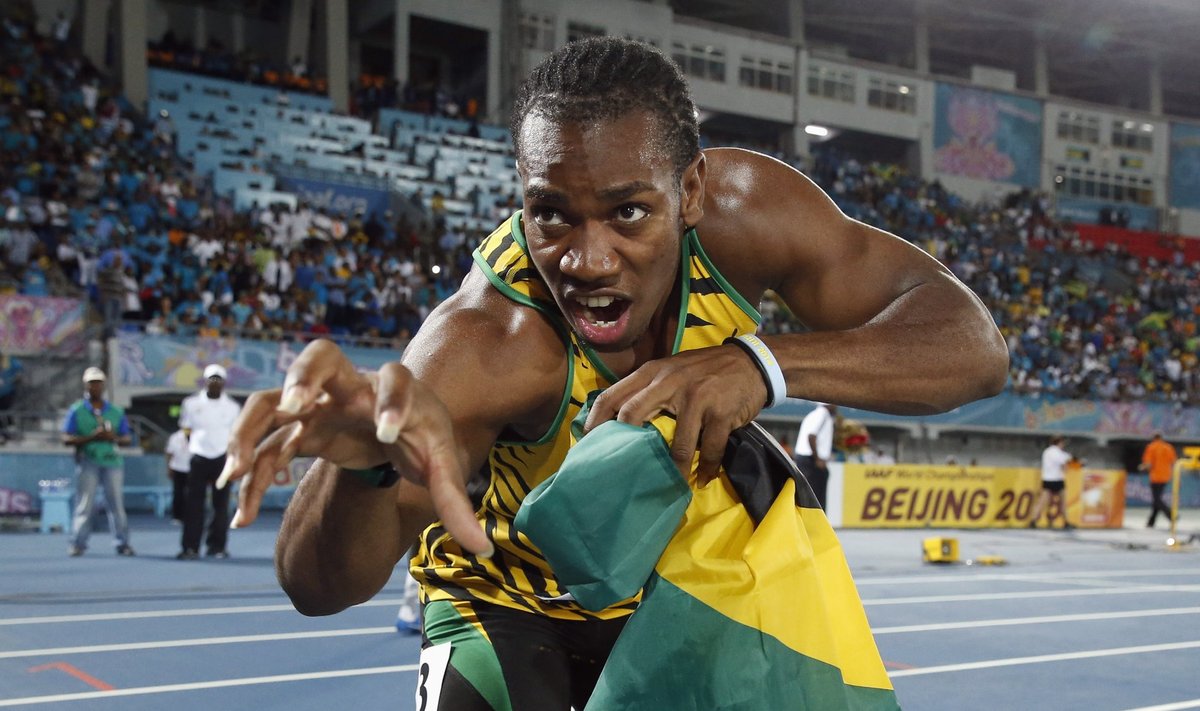 Jamaica's Yohan Blake poses for photographers after Jamaica set a new world record in winning the 4x200 metres relay at the IAAF World Relays Championships in Nassau