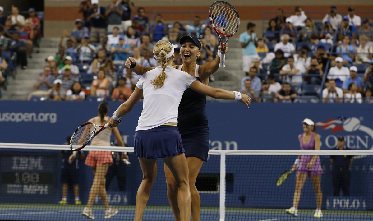 Makarova and Vesnina of Russia, celebrate after defeating Hingis of Switzerland and Pennetta of Italy in the women's doubles final match at the 2014 U.S. Open tennis tournament in New York