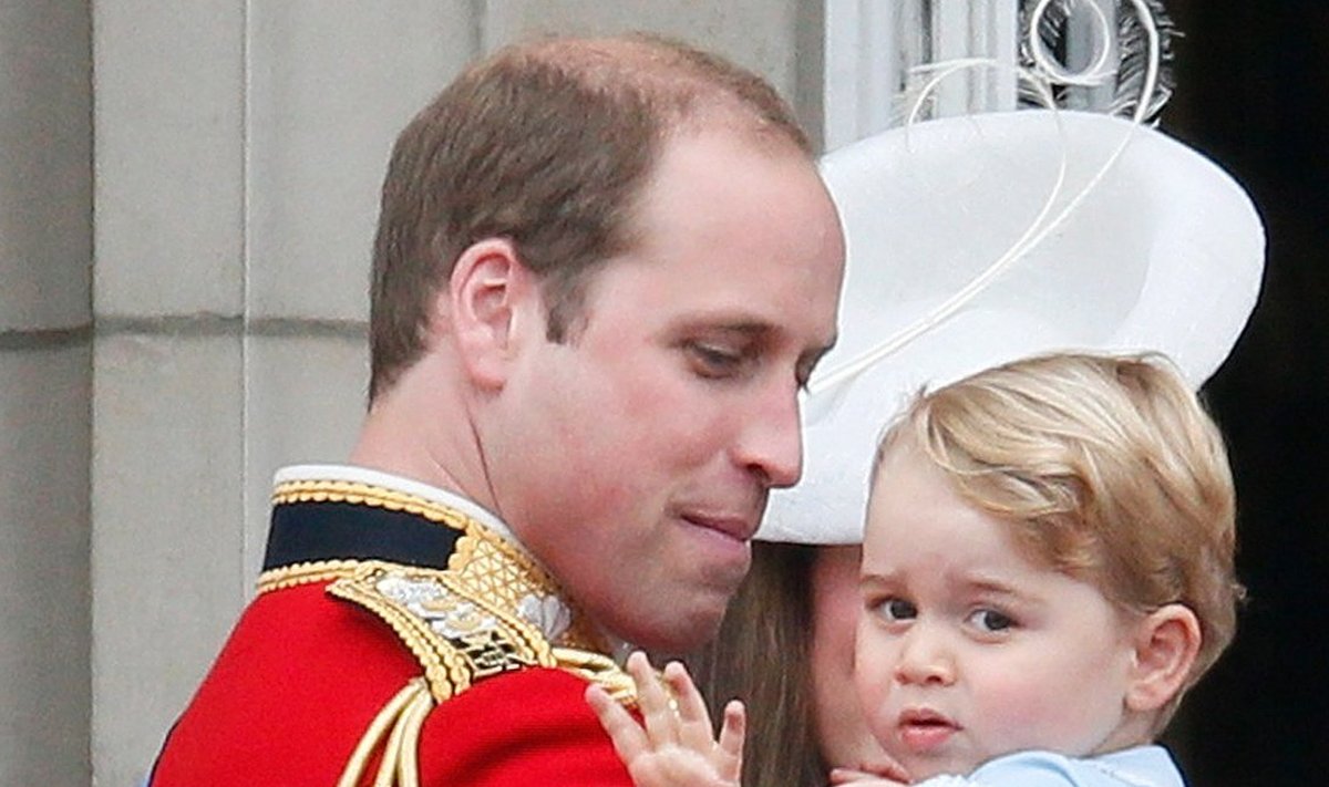 Britain's Prince Willian holds Prince George as he waves from the balcony at Buckingham Palace after the Trooping the Colour ceremony at Horse Guards Parade in central London