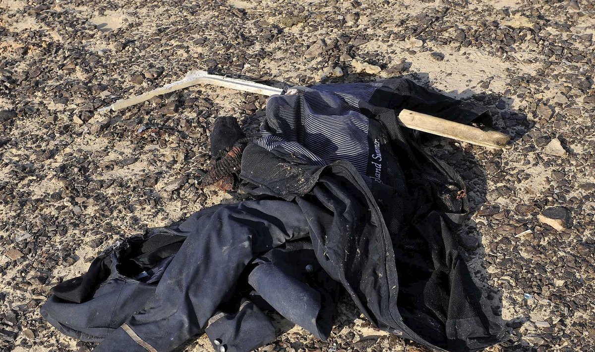 Clothes are pictured on the ground at the site where a Russian airliner crashed in central Sinai near El Arish city