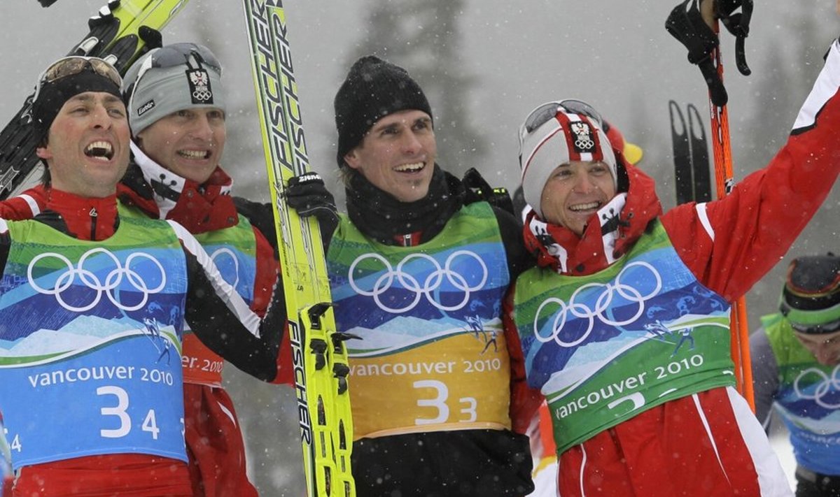 Austrian gold medal winning team, from left, Austria's Mario Stecher, Austria's Bernhard Gruber, Austria's Felix Gottwald and Austria's David Kreiner celebrate after the Men's Nordic Combined team event at the Vancouver 2010 Olympics in Whistler, British Columbia, Canada, Tuesday, Feb. 23, 2010. (AP Photo/Dmitry Lovetsky) / SCANPIX Code: 436