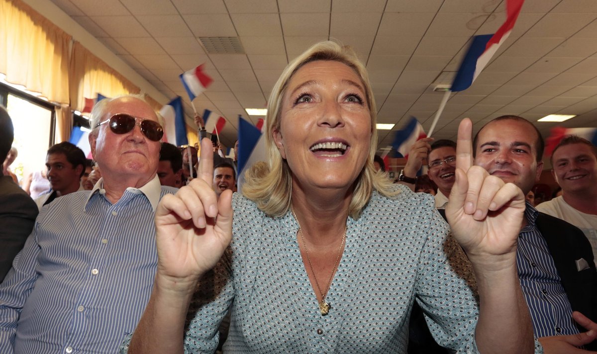 Marine Le Pen, France's National Front political party leader gestures as she attends with her father Jean Marie Le Pen and Frejus Mayor David Rachline the Front National party's weekend summer university youth meeting in Freju