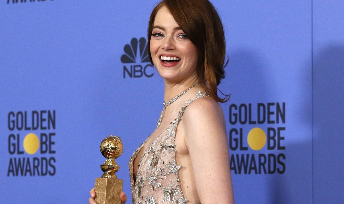 Emma Stone poses with her award during the 74th Annual Golden Globe Awards in Beverly Hills