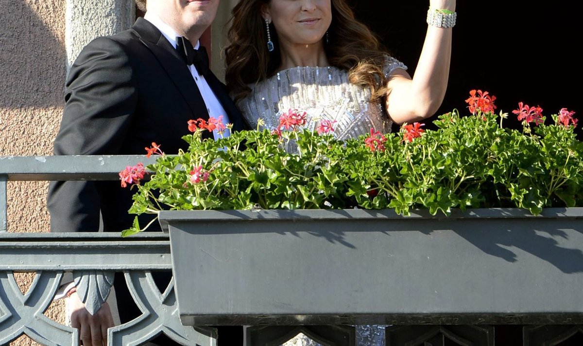 U.S. citizen Christopher O'Neill and Swedish Princess Madeleine wave from the balcony of Grand Hotel prior to a dinner for the couple in Stockholm