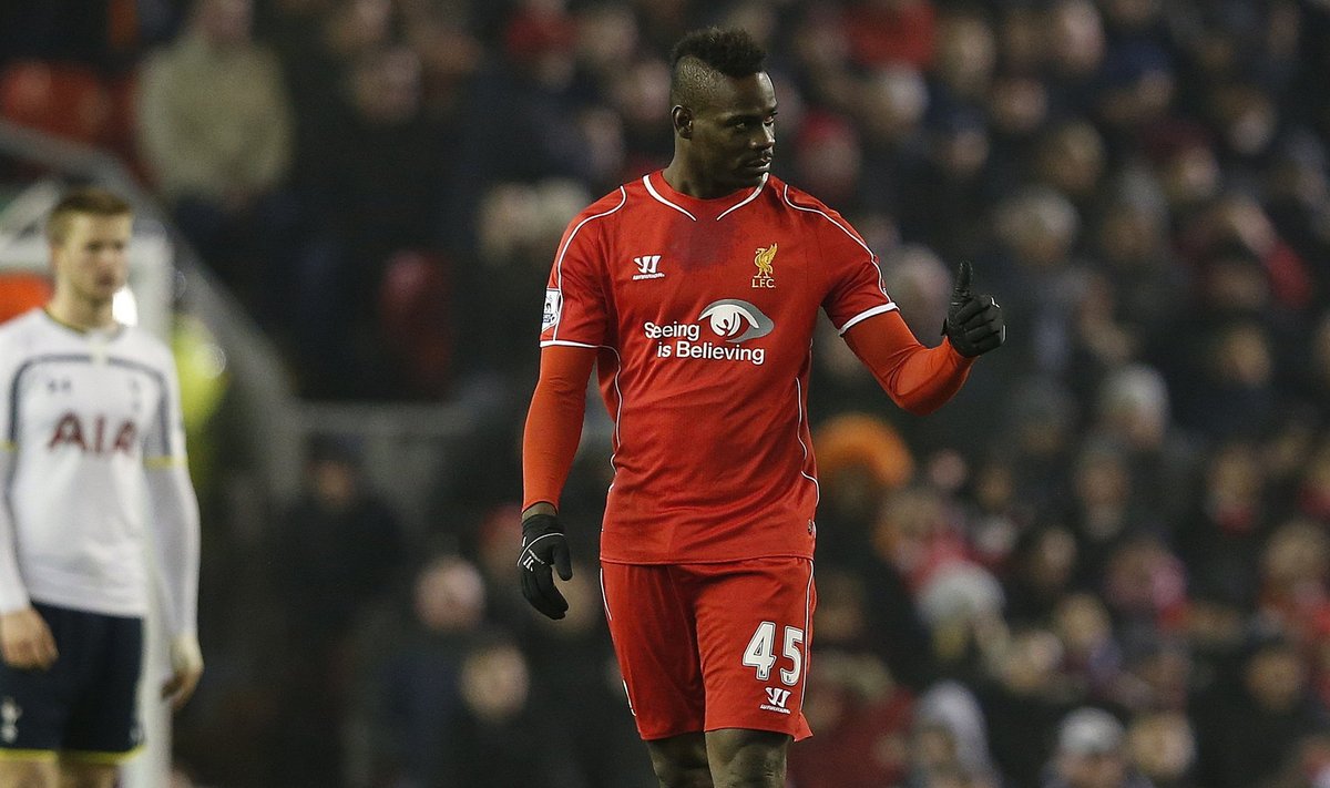 Liverpool's Balotelli gestures after scoring againstTottenham Hotspur during their English Premier League soccer match in Liverpool