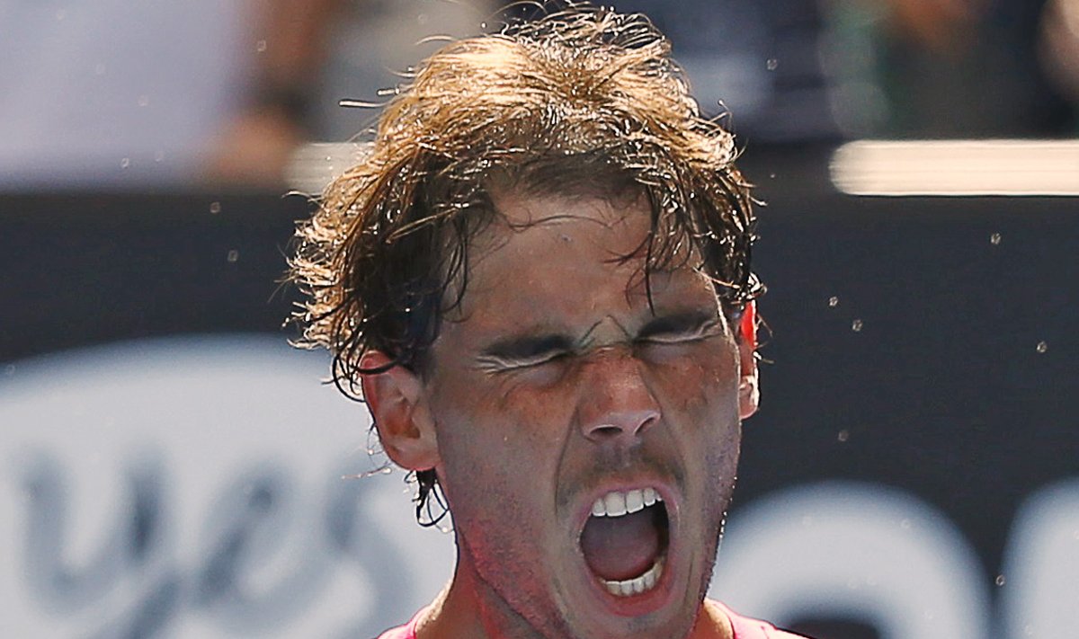 Nadal of Spain reacts after defeating Youzhny of Russia in their men's singles match at the Australian Open 2015 tennis tournament in Melbourne