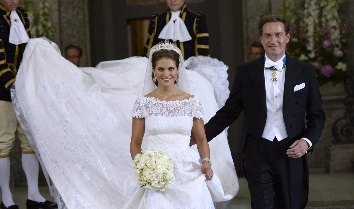 Sweden's Princess Madeleine and U.S.-British banker Christopher O'Neill smile as they leave the royal church after their wedding ceremony in the royal castle in Stockholm