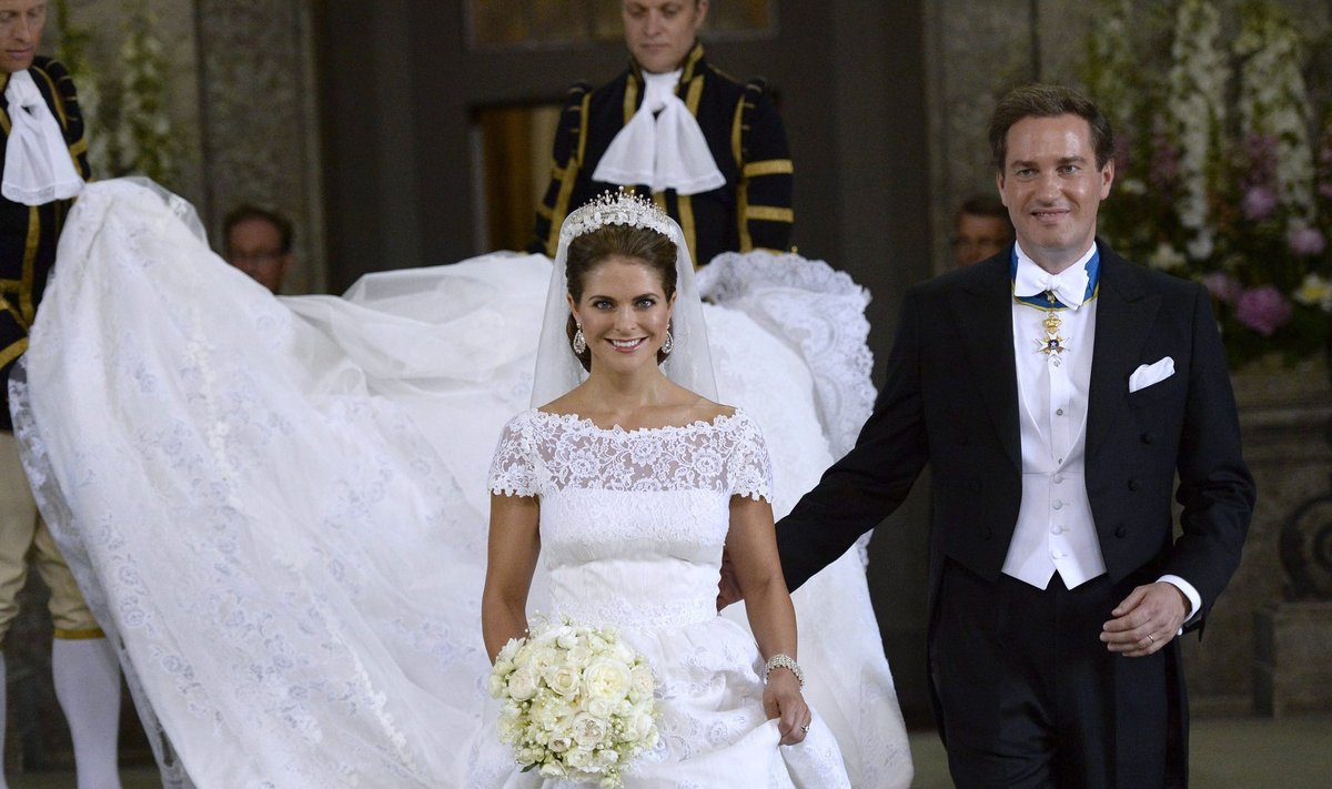 Sweden's Princess Madeleine and U.S.-British banker Christopher O'Neill smile as they leave the royal church after their wedding ceremony in the royal castle in Stockholm