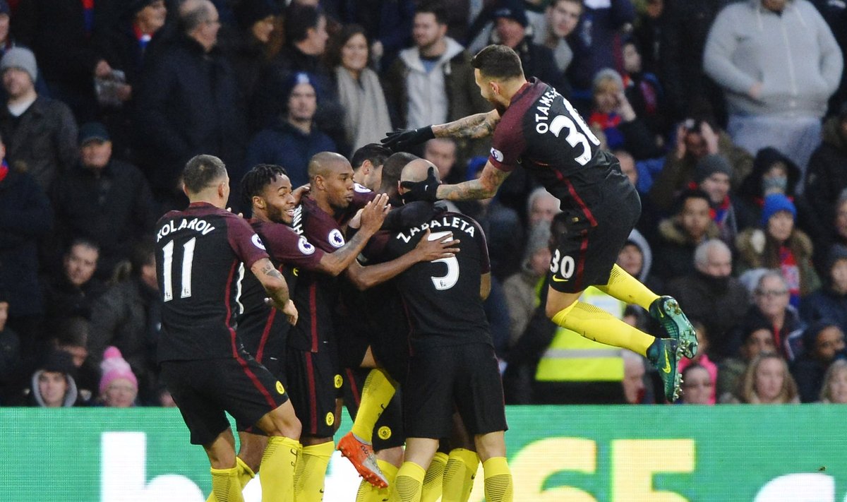 Manchester City's Yaya Toure celebrates scoring their first goal with team mates