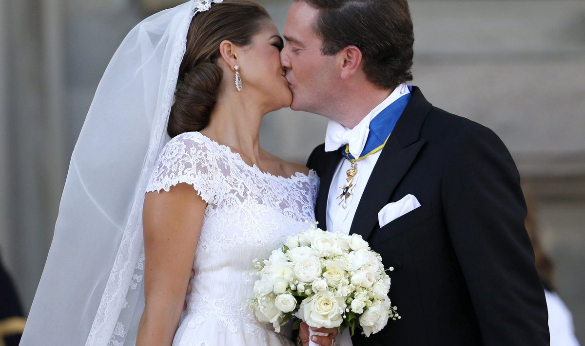 Sweden's Princess Madeleine kisses U.S.-British banker Christopher O'Neill outside the royal church after their wedding ceremony in the royal castle in Stockholm