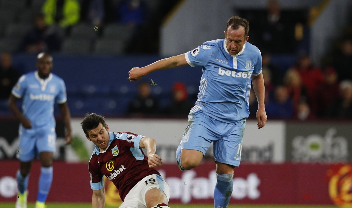 Burnley's Joey Barton in action with Stoke City's Charlie Adam