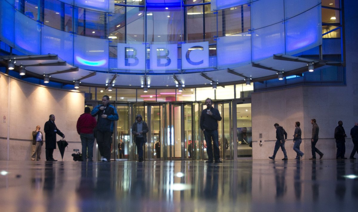 People arrive at, and leave, the BBC headquarters at New Broadcasting House in central London