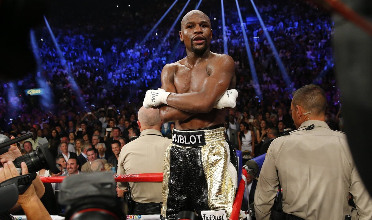 Mayweather, Jr. of the U.S. stands up on the ropes in his corner after defeating Pacquiao of the Philippines in their welterweight title fight in Las Vegas
