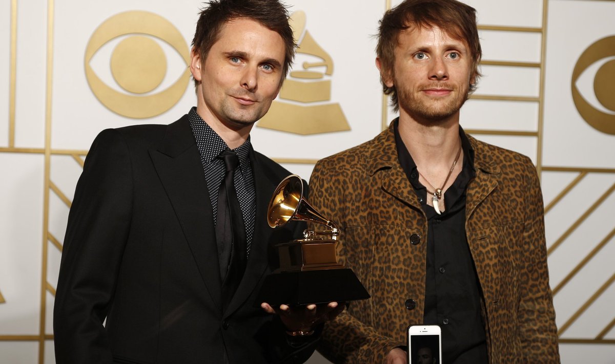 Matt Bellamy and Dominic Howard pose with their award during the 58th Grammy Awards in Los Angeles