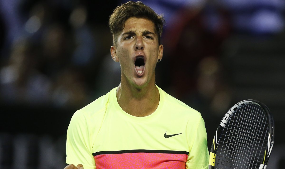 Thanasi Kokkinakis of Australia reacts after winning a point during his men's singles first round match against Ernests Gulbis of Latvia at the Australian Open 2015 tennis tournament in Melbourne