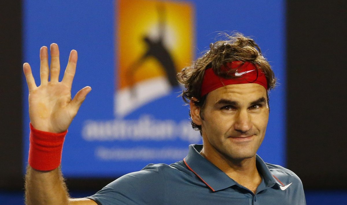Roger Federer of Switzerland celebrates defeating Jo-Wilfried Tsonga of France during their men's singles match at the Australian Open 2014 tennis tournament in Melbourne