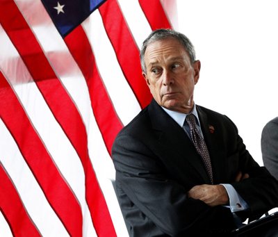 File photo of New York Mayor Bloomberg looking out a window during a news conference announcing a lease for commercial office space to the law firm WilmerHale