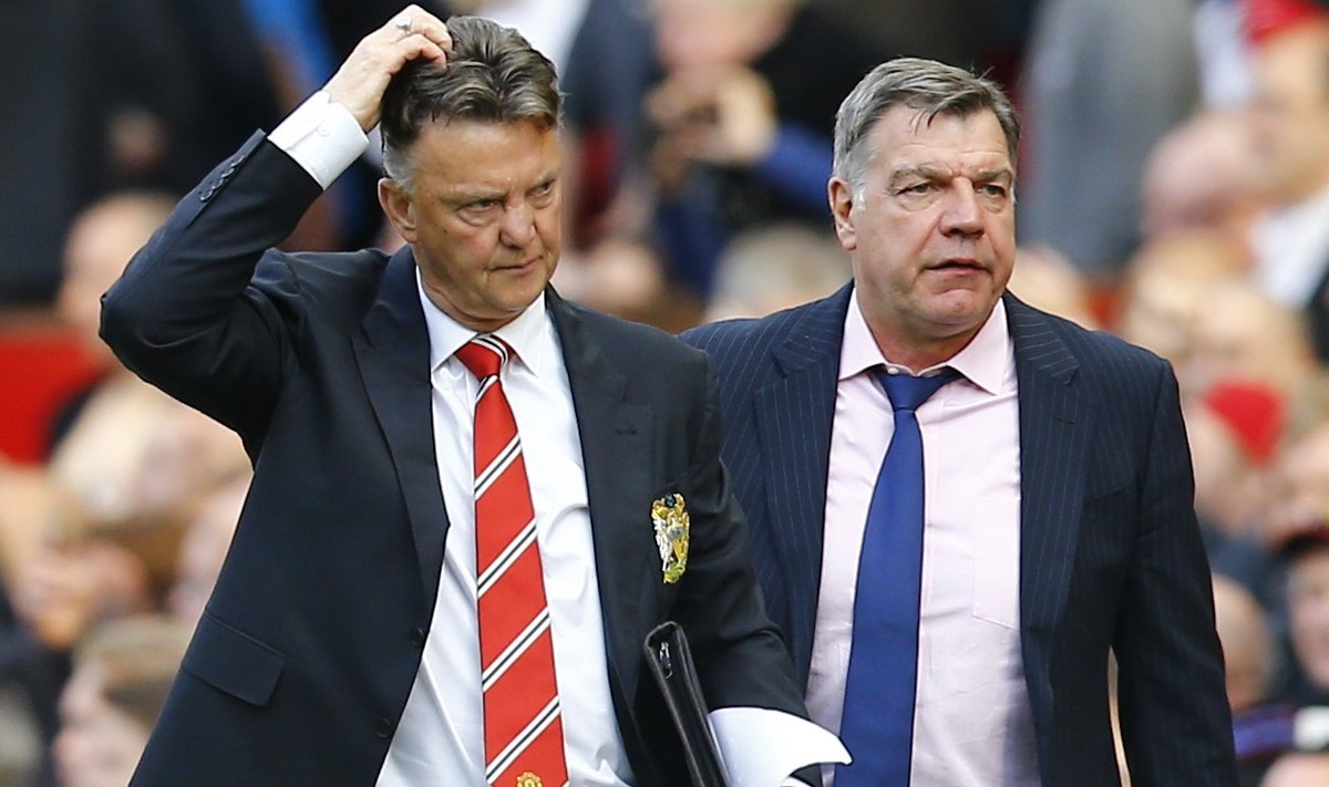 Manchester United's manager Louis van Gaal and West Ham United's manager Sam Allardyce leave the pitch after their English Premier League soccer match at Old Trafford in Manchester
