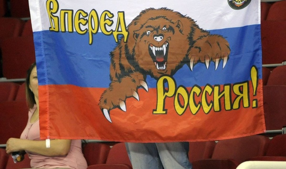 A supporter of Russia displays the Russian flag with a bear and a-Go Russia- catchword on the stand in the Volleyball European Championships Finals group B match between Finland and Russia in Istanbul, Turkey, on September 6, 2009.     AFP    PHOTO        LEHTIKUVA / Heikki Saukkomaa *** FINLAND OUT ***